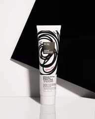 IGK Good Behavior balm applied in hands for easy distribution