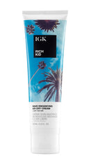 IGK Rich Kid bottle standup shows easy, portable styling for on-the-go hair care.