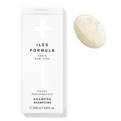 ILES FORMULA Shampoo bottle pour shows easy, sulfate-free cleansing for color-treated hair.