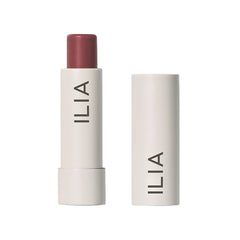 ILIA Balmy Tint Memoir balm tube closeup highlights creamy texture and hydrating formula for everyday wear.