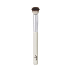 ILIA Complexion Brush with wood handle for precise makeup application on hard-to-reach areas.