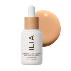 ILIA Super Serum Skin Tint Paloma bottle close-up showing dewy finish and SPF 40 protection.