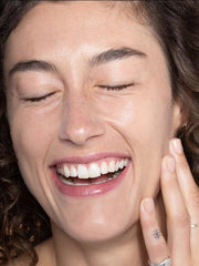 ILIA Super Serum Skin Tint SPF 40 swatch on hand demonstrates sheer-to-buildable coverage and glow.