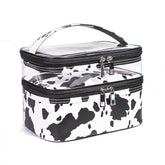 Imerelez double-layer cosmetic bag in cow print; top view for organized makeup.