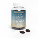 Inner Glow Sol Defense bottle on a vanity for daily skin resilience support.