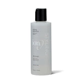 Ion Silk Drops bottle with hair application delivers smooth shine.