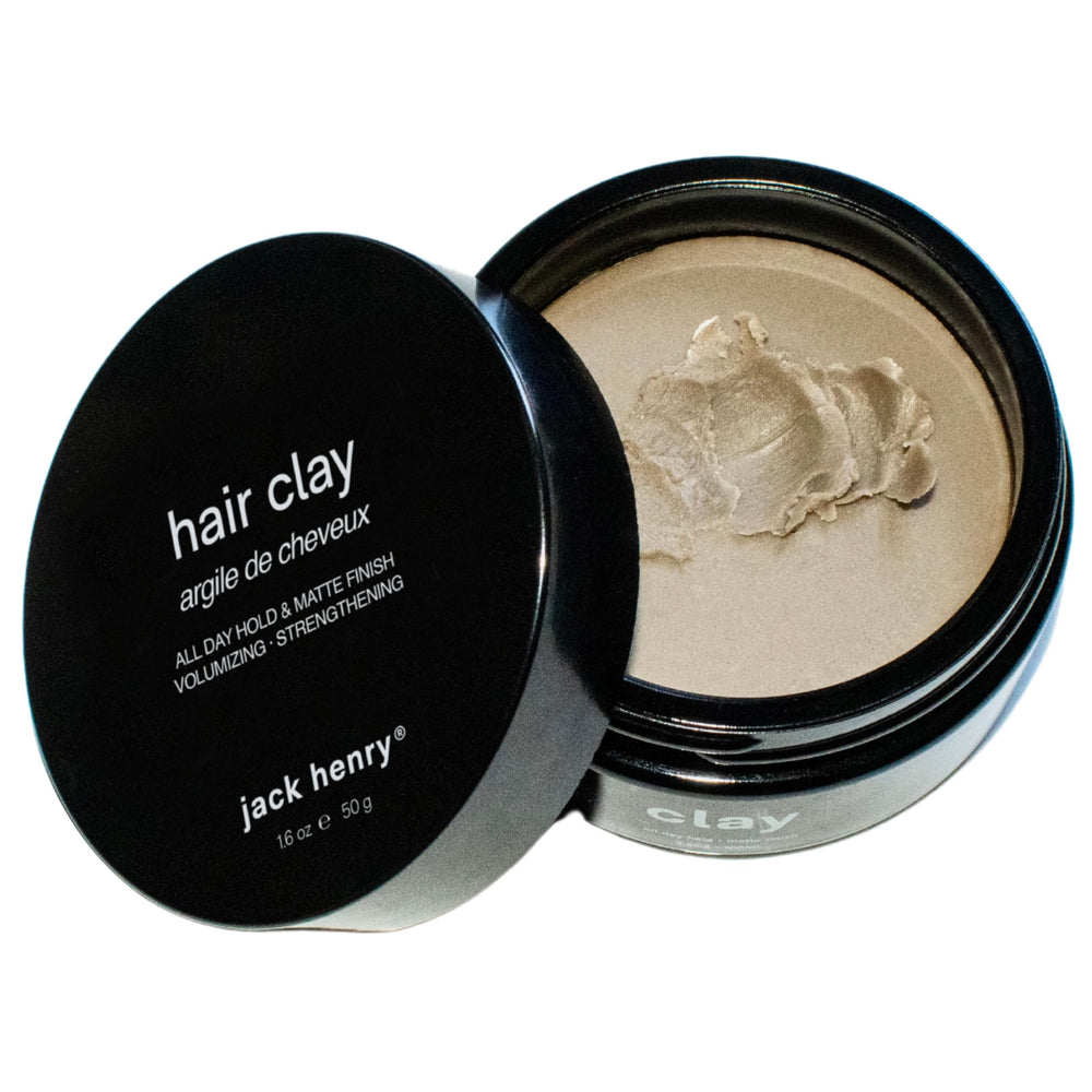 Jack Henry Premium Hair Clay jar closeup shows matte finish and natural scent.