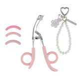 JAPONESQUE Heart Defensor Pro Curler with keychain and cherry blossom charm for on-the-go styling.
