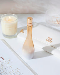 Jennifer Lopez Enduring Glow cap closeup highlights elegant packaging.