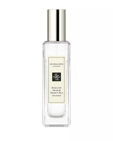 Jo Malone English Pear & Seet Pea Cologne bottle swirl captures fresh pear notes for everyday elegance.