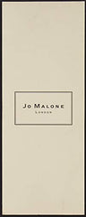 Close-up of Jo Malone Nectarine Blossom & Honey bottle highlighting luminous fruit notes.