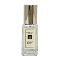 Jo Malone Nectarine Blossom & Honey travel-size cologne bottle for on-the-go freshness and fruity-floral allure.