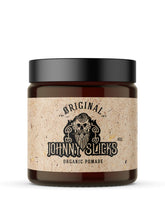 Johnny Slicks oil-based pomade original jar close-up showing natural ingredients for healthy hair.