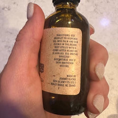 Johnny Slicks Organic Beard Oil label front communicates clean ingredients for healthier grooming.