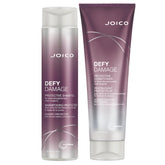 Joico Defy Damage shampoo bottle shows color protection and bond strengthening for color-treated hair.