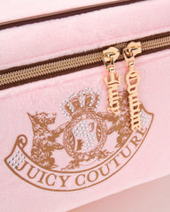 Juicy Couture pink makeup bag zipper close keeps items secure on commutes.