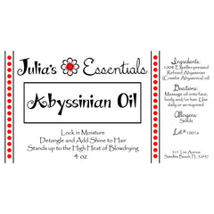 Julia's Essentials Abyssinian oil on hair showing frizz control and shine.