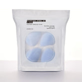JUNO & Co. Microfiber sponge set laid flat for four-pack viewing, suggesting easy routine integration.