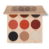 Juvia's Place Warrior 2 palette open pan with vibrant pigments for bold eye looks.