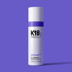 K18 AirWash Dry Shampoo spray action for quick root refresh.
