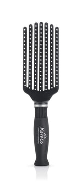 KareCo Mini Tangle Buster Brush in hand ready for quick detangling on the go