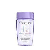 KÉRASTASE Blond Absolu Lumière shampoo bottle shining on lightened hair use case