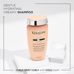Gently lathered shampoo on curls provides gentle cleansing and shine with KÉRASTASE Curl Manifesto Hydratation Douceur.