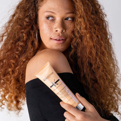 Kerastase Curl Manifesto cream applied from roots to ends for even distribution