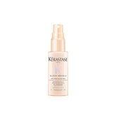 Kérastase Gloss Absolu Glaze Milk bottle pours for detangling and long-hair smoothness