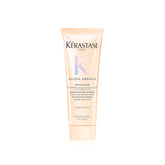 Kerastase Gloss Absolu bottle demonstrates travel-size conditioning for glossy, frizz-resistant hair.