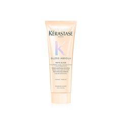 Kerastase Gloss Absolu bottle demonstrates travel-size conditioning for glossy, frizz-resistant hair.