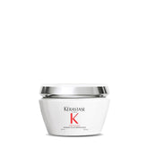 KÉRASTASE Premiere anti-breakage mask bottle on vanity for smoother, shinier hair.
