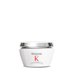 KÉRASTASE Premiere anti-breakage mask bottle on vanity for smoother, shinier hair.