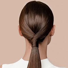 Kérastase Resistance Serum Therapiste hands-application demonstrates even distribution for smooth, hydrated lengths.