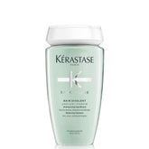 KÉRASTASE Specifique Balancing Shampoo bottle pour shows oil-control action for refreshed scalp.