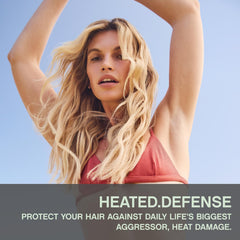 KEVIN.MURPHY HEATED.DEFENSE foam application demonstrates detangling and smoothing on styled strands.