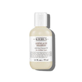 Kiehl's Amino Acid Shampoo bottle pour showcases lightweight cleansing for daily use.