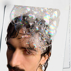 Kiehl's Amino Acid Shampoo wet hair lather demonstrates lightweight cleansing and volume.