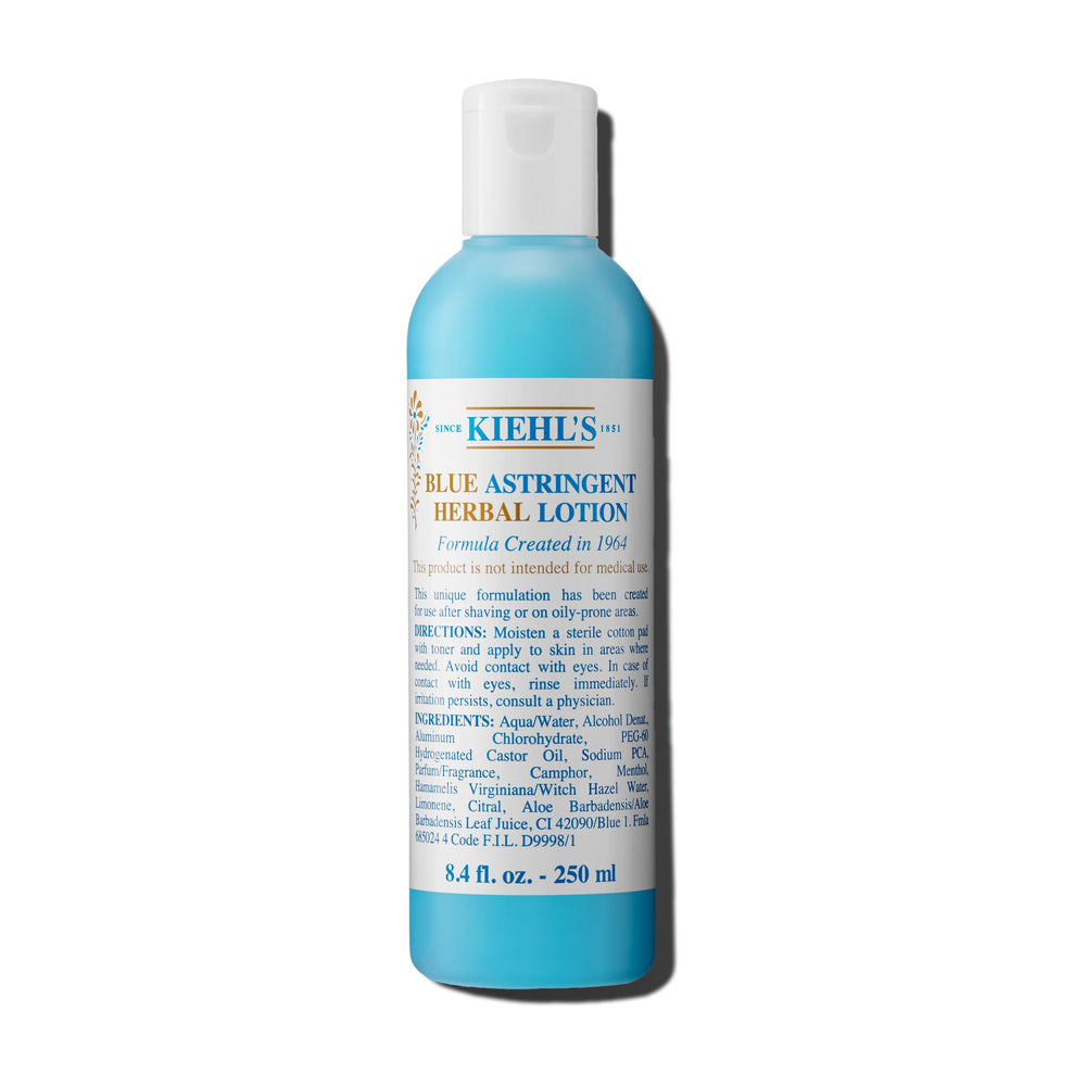 Kiehl's Blue Astringent Herbal Lotion bottle on shelf balances oil and refreshes skin