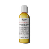 Kiehl's Creme de Corps oil-to-foam cleanser bottle front promotes smooth cleansing.