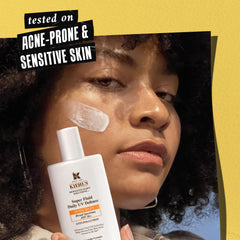 Kiehl's Super Fluid UV Defense SPF50 swirls on skin, promoting a sheer, non-greasy finish.