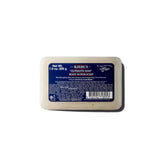 Kiehl's Ultimate Man Body Scrub bar packaging and bar for a deep cleansing routine.