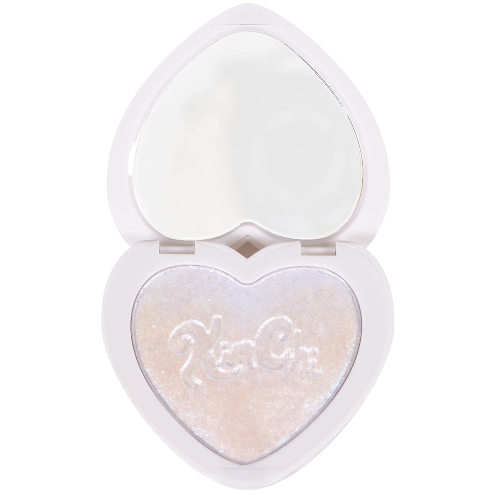Kimchi Chic Pearl Gone Wild Highlighter compact showing iridescent glow on face