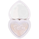 Kimchi Chic Pearl Gone Wild Highlighter compact showing iridescent glow on face