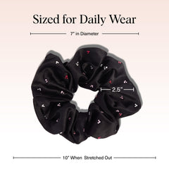 Kitsch black fabric rhinestone scrunchie worn in an updo for day-to-night styling.