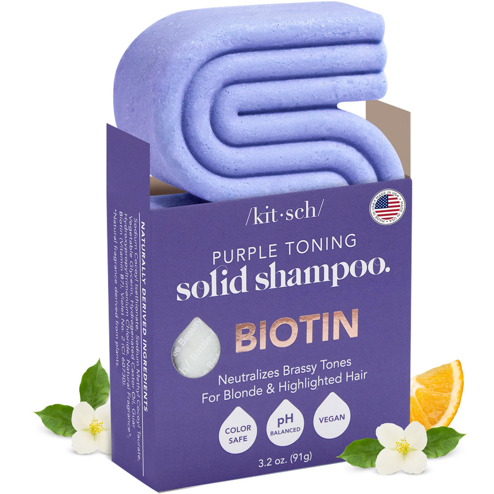 Kitsch Toning Purple Shampoo Bar held in hand neutralizing brass for cooler blonde tones.
