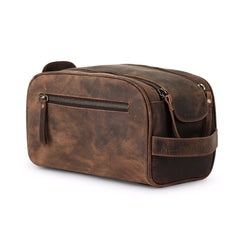 KomalC leather toiletry bag close-up zipper for secure travel storage.
