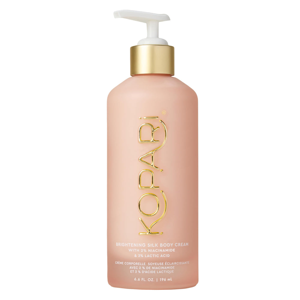 Kopari Brightening Silk Body Cream bottle with niacinamide for radiant, even skin tone.