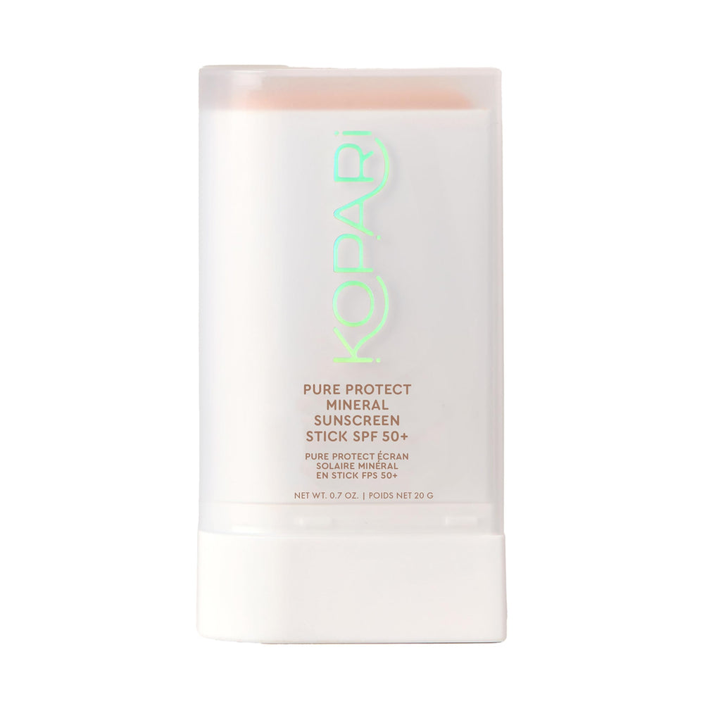 Kopari Pure Protect sunscreen stick applying smoothly for clear face coverage.