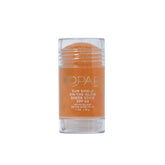 Kopari Sun Shield On-The-Glow stick gliding on the face for UV protection